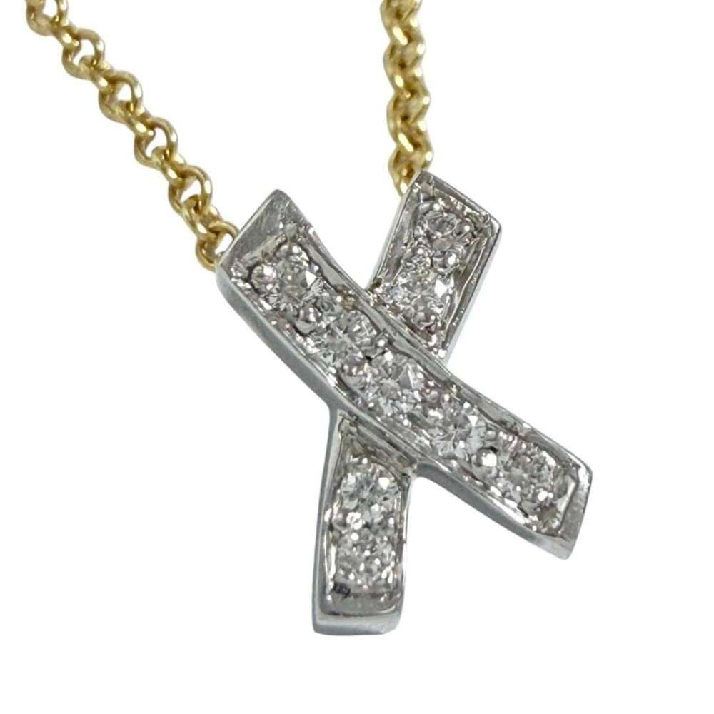 Tiffany & Co. Kiss pendant necklace, 18K gold, platinum, diamonds.